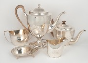 A Georgian antique English sterling silver five piece tea and coffee service with trivet, attractively engraved with ownership monogram, made in Newcastle, early 19th century. the largest 29cm high, 2330 grams total (including timber handles).