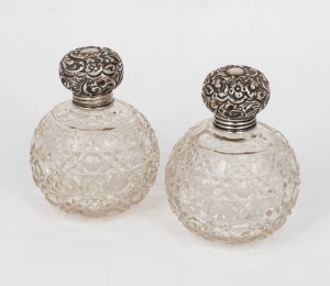 A pair of antique hobnail cut spherical crystal vanity jars with sterling silver tops, late 19th century, 11cm high.