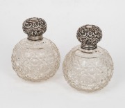 A pair of antique hobnail cut spherical crystal vanity jars with sterling silver tops, late 19th century, ​​​​​​​11cm high.