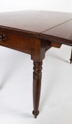 An antique English mahogany drop-side dining table fitted with single drawer to the end and dummy drawer on the reverse, circa 1835, 75cm high, 67cm wide (extends to 116cm), 121cm deep - 3