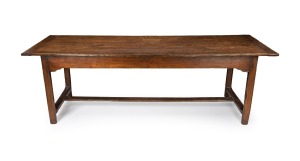 An antique French elm farmhouse table with cleated plank top, breadboard ends and stretcher base, 76cm high, 234cm wide, 80cm deep.