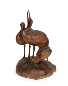 A Japanese carved wooden figural group of three cranes, signed on the base, 19th/20th century, ​​​​​​​40cm high