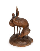 A Japanese carved wooden figural group of three cranes, signed on the base, 19th/20th century, ​​​​​​​40cm high