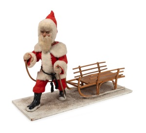 AUTOMATON: Santa and sleigh clockwork mechanism, manufactured in Germany, mid 20th century. Note: Prominently displayed in the window of the Halls of Toorak shoe shop, Melbourne. 49cm high, 65cm long overall.