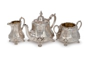 An antique Scottish sterling silver tea service with engraved decoration, made in Edinburgh, circa 1853, (3 items), the teapot 19cm high, 1500 grams total.
