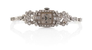 OMEGA ladies cocktail wristwatch in 18ct white gold case with 9ct white gold band, adorned with pave set brilliant cut white diamonds, 16.8 grams total excluding movement.