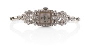 OMEGA ladies cocktail wristwatch in 18ct white gold case with 9ct white gold band, adorned with pave set brilliant cut white diamonds, 16.8 grams total excluding movement.