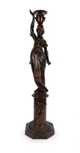 An antique carved timber Blackamoor stand, 19th century, 201cm high.