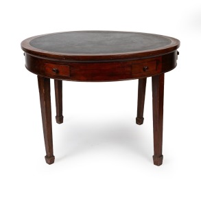 An antique Australian cedar circular games table with insert black leatherette top and fitted with drawers, early 20th century, 74cm high, 108cm diameter