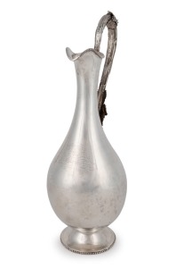 WILLIAM EDWARDS (attributed) of Melbourne Australian silver wine ewer, repousse decoration with applied grapes and leaves, engraved "PRESENTED BY F.C. WALKER TO P. GLENISTER AS A TOKEN OF RESPECT, July 23rd, 1873", 19th century, stamped "W.E." flanked by kangaroo and emu marks, 32cm high, 574 grams