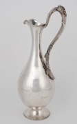 WILLIAM EDWARDS (attributed) of Melbourne Australian silver wine ewer, repousse decoration with applied grapes and leaves, engraved "PRESENTED BY F.C. WALKER TO P. GLENISTER AS A TOKEN OF RESPECT, July 23rd, 1873", 19th century, stamped "W.E." flanked by - 2