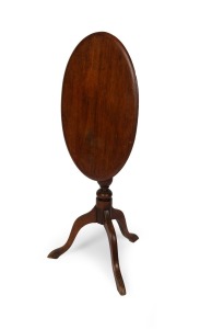An antique English mahogany and beech oval tilt-top wine table, 19th century, ​​​​​​​70cm high, 60cm wide, 40cm deep.