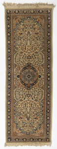 A Persian hand-knotted wool runner rug, beige ground with blue highlights, 200 x 66cm including fringe