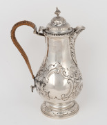 An antique English sterling silver coffee pot with repousse decoration and woven cane handle, made in London, circa 1900, 23cm high, 502 grams.