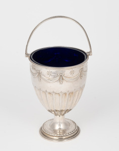 An antique English sterling silver bonbon dish with swing handle and original Bristol blue glass liner, by Horace Woodward of London, circa 1873, 19.5cm high overall, 173 grams (not including liner).