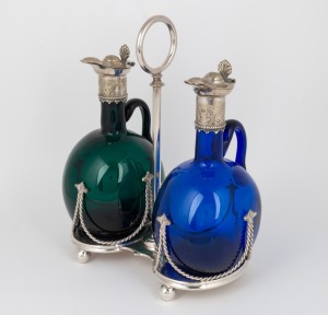 An antique two bottle coloured glass decanter stand with silver plated mounts, 19th century, the stand 25cm high.