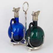 An antique two bottle coloured glass decanter stand with silver plated mounts, 19th century, ​​​​​​​the stand 25cm high. - 2