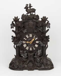 BLACK FOREST antique German cuckoo clock with carved mountain goat finial and twin train movement, 19th century, 49cm high.