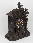BLACK FOREST antique German cuckoo clock with carved mountain goat finial and twin train movement, 19th century, 49cm high. - 2