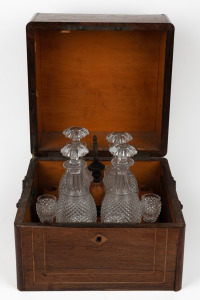 An antique French boxed tantalus decanter set in burr walnut case, housing four cut crystal decanters and six glasses, (Note: Originally made for twelve, six glasses missing), 19th century, 26cm high, 30cm wide, 29cm deep.