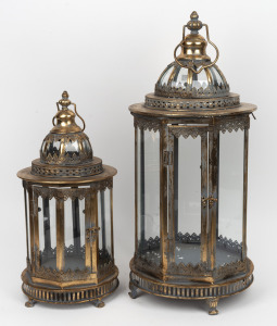 A graduated pair of Indian metal and glass lanterns with gold finish, 56cm and 72cm high.