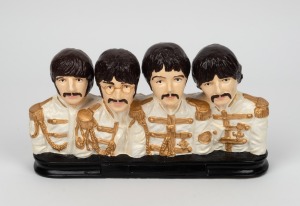 THE BEATLES hand-painted plaster reproduction figural group, 17cm high, 28cm wide.
