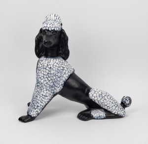 A vintage porcelain statue of a French poodle, mid 20th century, ​​​​​​​49cm high, 53cm long.