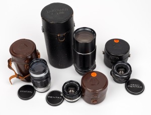 ASAHI KOGAKU: Group of four lenses, each in Asahi lens container - one M42 Super-Takumar 200mm f4 with rear lens cap, one screw-mount Takumar 135mm f3.5 with front and rear lens caps, one M42 Super-Takumar 35mm f3.5 with front and rear lens caps, and one 