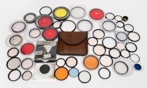 VARIOUS MANUFACTURERS: An accumulation of more than fifty lens filters of varying size and colour, from brands such as Arrow, Hoya, Kenko, and Walz. (50+ items)