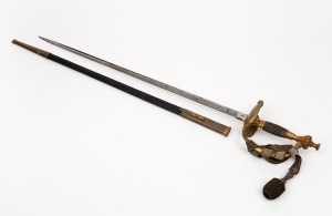 An antique German parade sword with decorative acid etched blade signed "R. Trautvetter, Dresden", housed in original leather sheath with accoutrements, 19th century, 80cm long overall.
