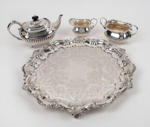 A silver plated three piece tea service on an attractive and handsomely engraved serving tray, 19th/20th century, (4 items), the tray 42cm wide
