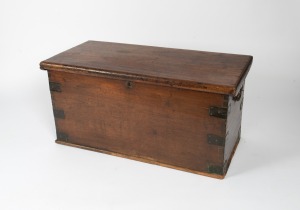 An antique travelling trunk fashioned in teak with iron strapping to the corners, 19th century, ​​​​​​​52cm high, 107cm wide, 50cm deep.