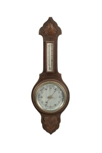 An antique English wall mounted aneroid barometer thermometer, 19th/20th century, 68cm high overall.