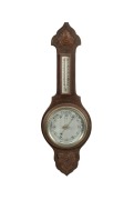 An antique English wall mounted aneroid barometer thermometer, 19th/20th century, 68cm high overall.