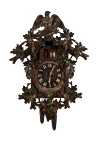 BLACK FOREST antique German cuckoo wall clock with three train weight driven movement playing a Swiss music box cylinder movement on the hour, with remnants of polychrome finish, 19th century. Note: Mismatched pendulum but weights present. 84cm high.