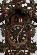 BLACK FOREST antique German cuckoo wall clock with three train weight driven movement playing a Swiss music box cylinder movement on the hour, with remnants of polychrome finish, 19th century. Note: Mismatched pendulum but weights present. 84cm high. - 2