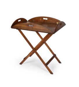 An antique mahogany butler's table with folding base, lift top and folding sides, 19th century, 72cm high, 80cm wide, 53cm deep with sides up.