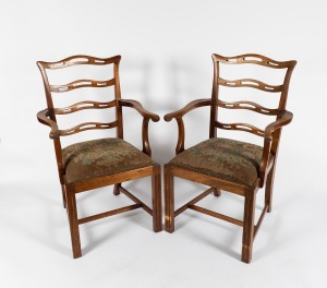 A pair of Georgian style ladderback carver chairs with tapestry drop-in seats, early to mid 20th century, ​​​​​​​60cm across the arms.