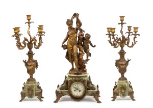 An impressive antique French three piece figural clock set, gilt metal and green onyx with eight day time and strike movement and candelabra garniture, 19th century, ​​​​​​​the clock 70cm high