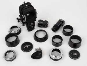 OLYMPUS: An accumulation of fourteen camera accessories, including three different Pen F lens mount adapters, one Pen F right-angle magnifier, one Pen F light meter, one Pen F bellows, five lens hoods, and others. (14 items)