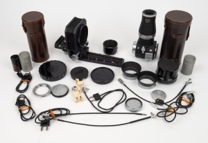 LEITZ: An accumulation of thirty camera accessories, including three shutter release cables, one bellows, three lens hoods, six flash cables, and many others. (30 items)