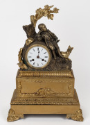 An antique French figured mantle clock in ornate gilt bronze ormolu case with eight day time and bell striking movement, circa 1850s. (Note: dial damaged). 40cm high.
