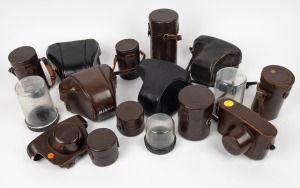 NIPPON KOGAKU: An accumulation of sixteen leather camera and lens cases, from various eras. (16 items)