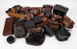 VARIOUS MANUFACTURERS: An accumulation of twenty-six leather camera and accessory cases, from manufacturers such as Ihagee, Kodak, and Olympus. (26 items)