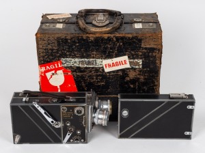 KODAK: Cin&eacute;-Kodak Special II 16mm movie camera in leather case with three lenses with front and rear lens caps and additional film magazine, c. 1950s.