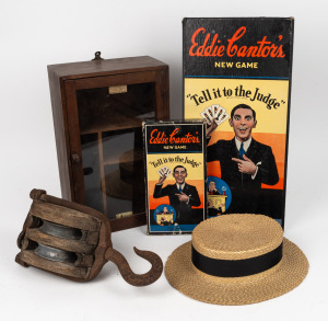 An antique straw boater with silk lining adorned with Australian coat of arms; together with an antique pulley block, antique medicine cabinet and "The Eddie Cantor New Game, Tell it to the Judge", 19th and 20th century, (4 items), the cabinet 40cm high