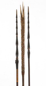 Three tribal spears, carved wood and natural fibres, ​​​​​​​the largest 255cm long.