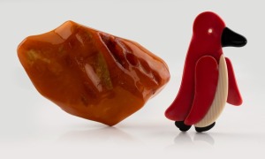 LEA STEIN vintage French bakelite penguin brooch; together with an impressive natural amber specimen brooch with silver clasp, (2 items), the penguin 5.5cm high, the amber 7.5cm wide