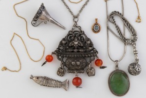 A Sino-Tibetan silver pendant on chain, a greenstone and silver pendant on silver chain, an Albertina style fob chain with bauble, a miniature silver funnel, a gold plated necklace, a 9ct gold and blue topaz pendant and an articulated fish pendant, mixed 
