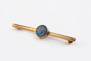 A 9ct gold and opal doublet brooch, stamped "9ct", 4.7cm wide, 2.5 grams